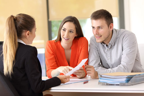 A credit Services Organization agent meets with clients.