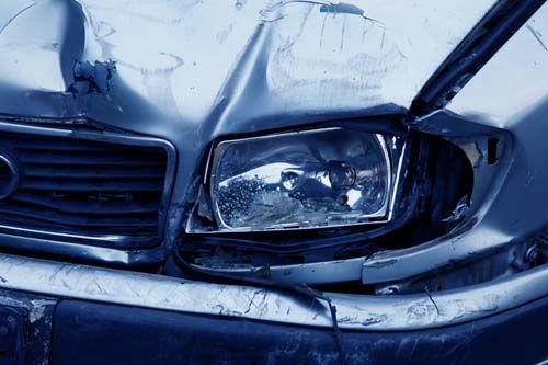 A damaged car at a body shop