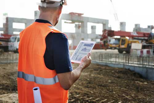 A commerical general contractors works on a construction project