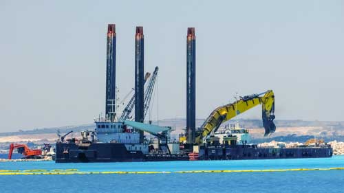 A construction crew works on a waterway project