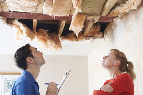 A Public Adjuster works with a client on an insurance claim