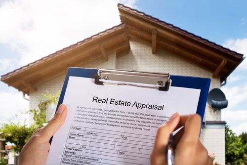 An Alaska real estate appraiser examines a home.